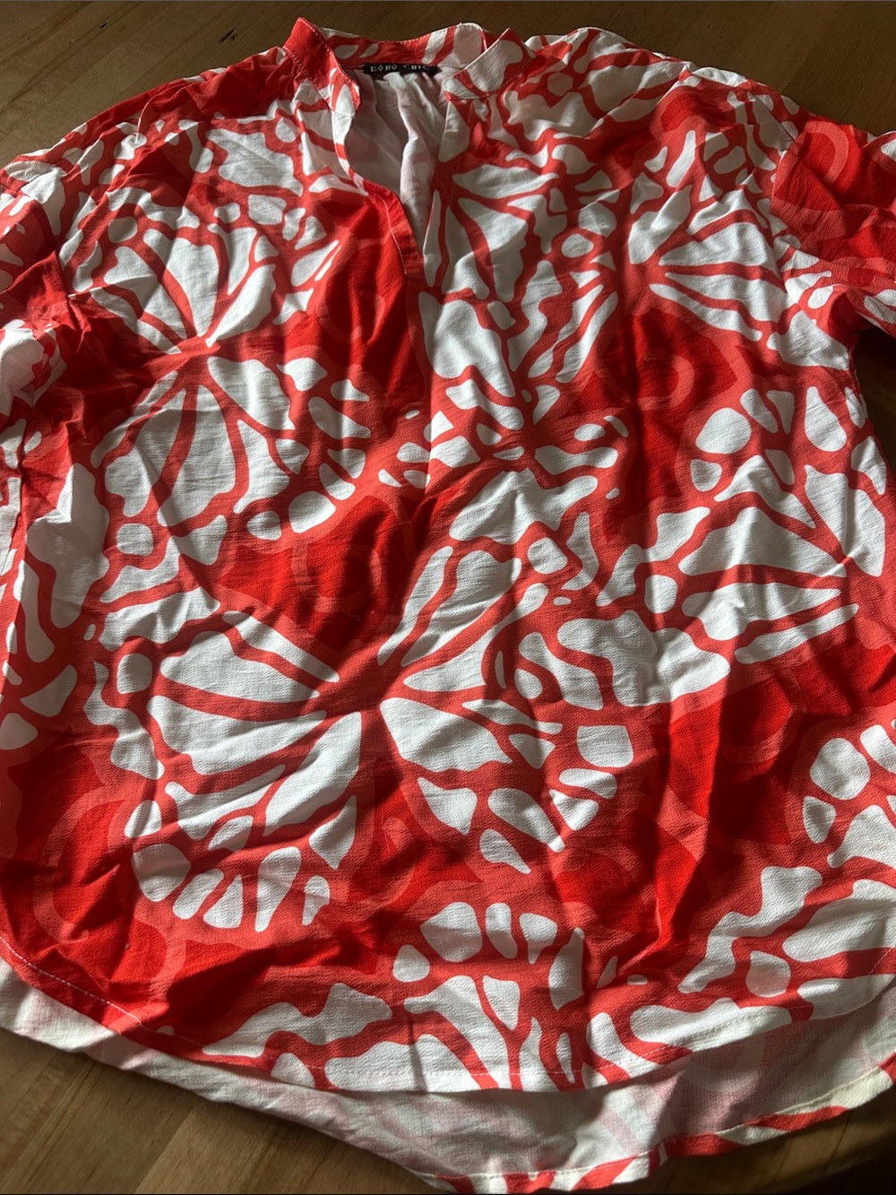 Women’s Red and White Abstract-Print V-Neck Blouse